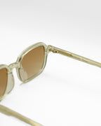 Vesper sunglasses by SWT, transparent amber acetate with brown gradient lenses, side view