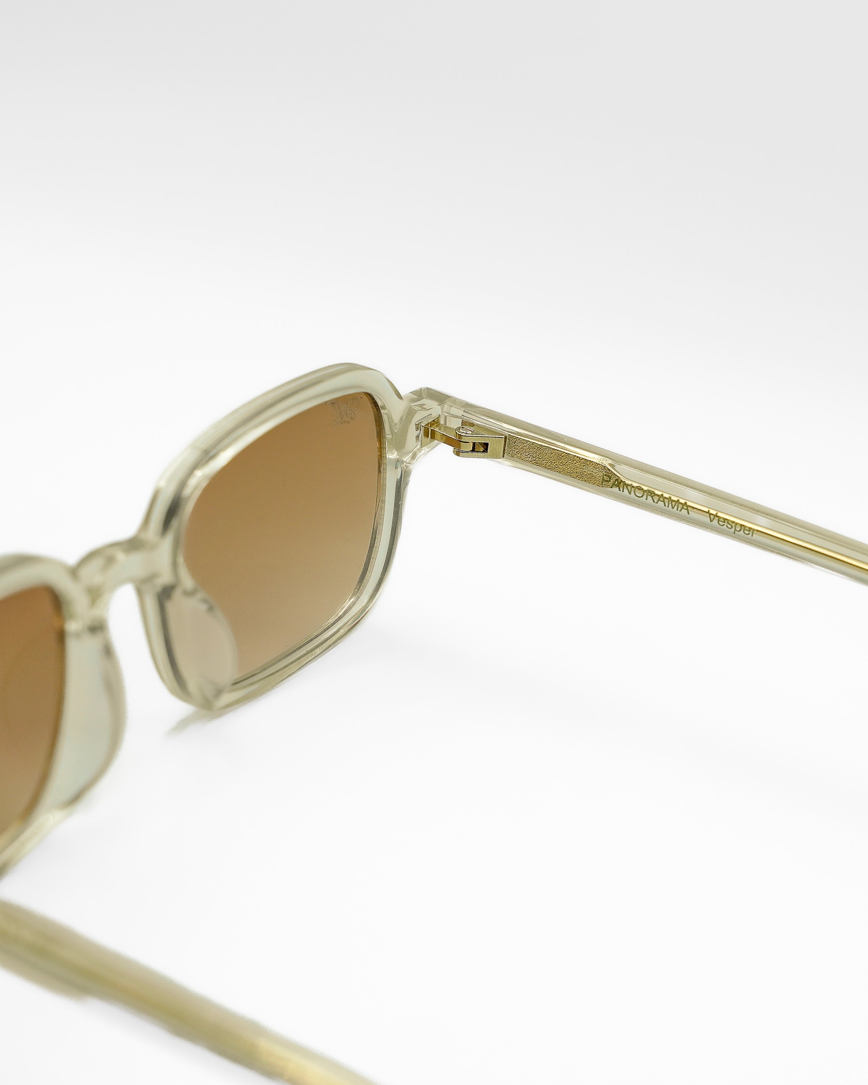 Vesper sunglasses by SWT, transparent amber acetate with brown gradient lenses, side view