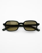 Miramare sunglasses by SWT, black rectangular frame with yellow-green gradient lenses, front view