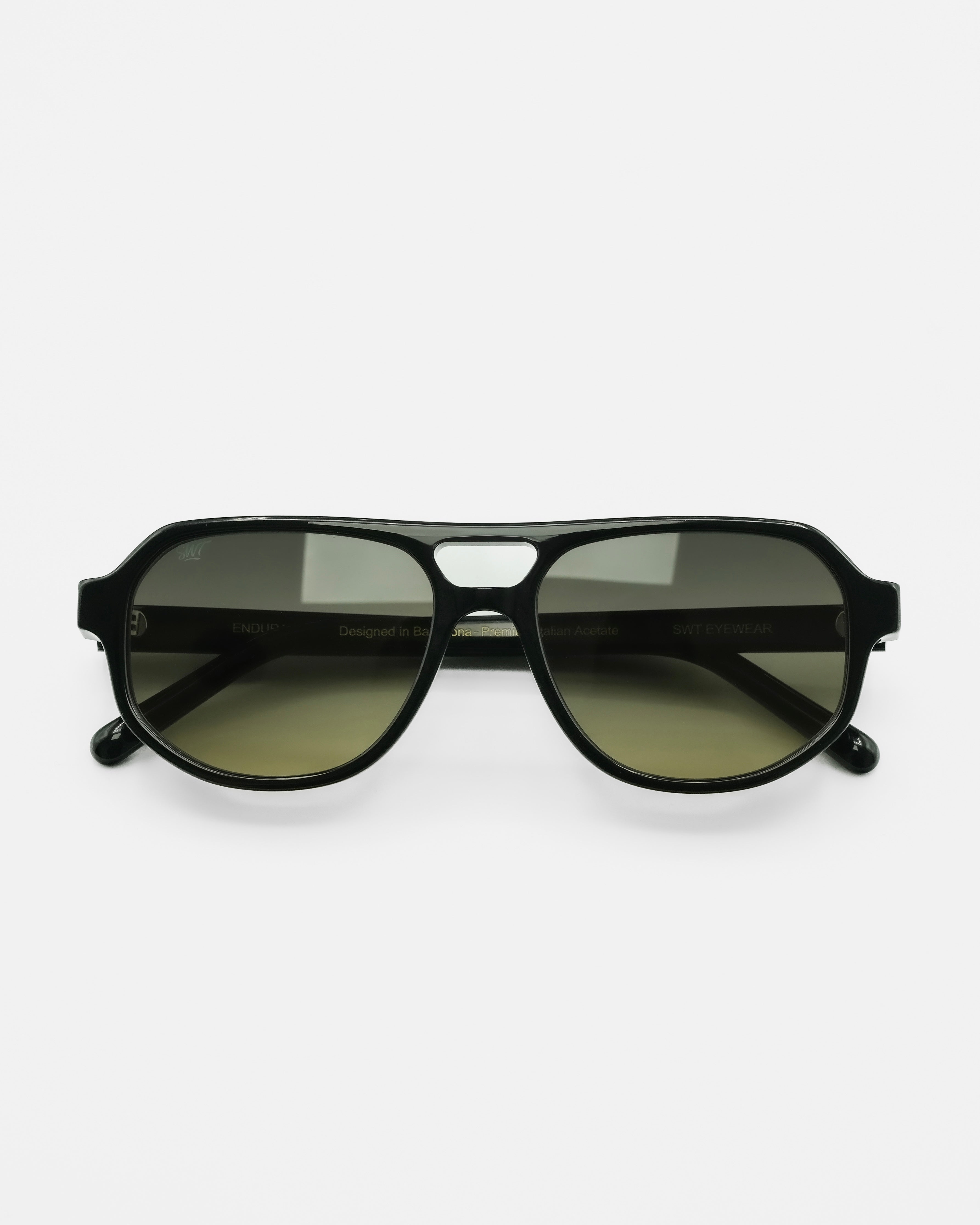 Sundown sunglasses by SWT, black aviator frame with green to yellow gradient lenses, front view