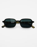 Lido sunglasses by SWT, rectangular frame with black front and amber tortoiseshell temples, front view