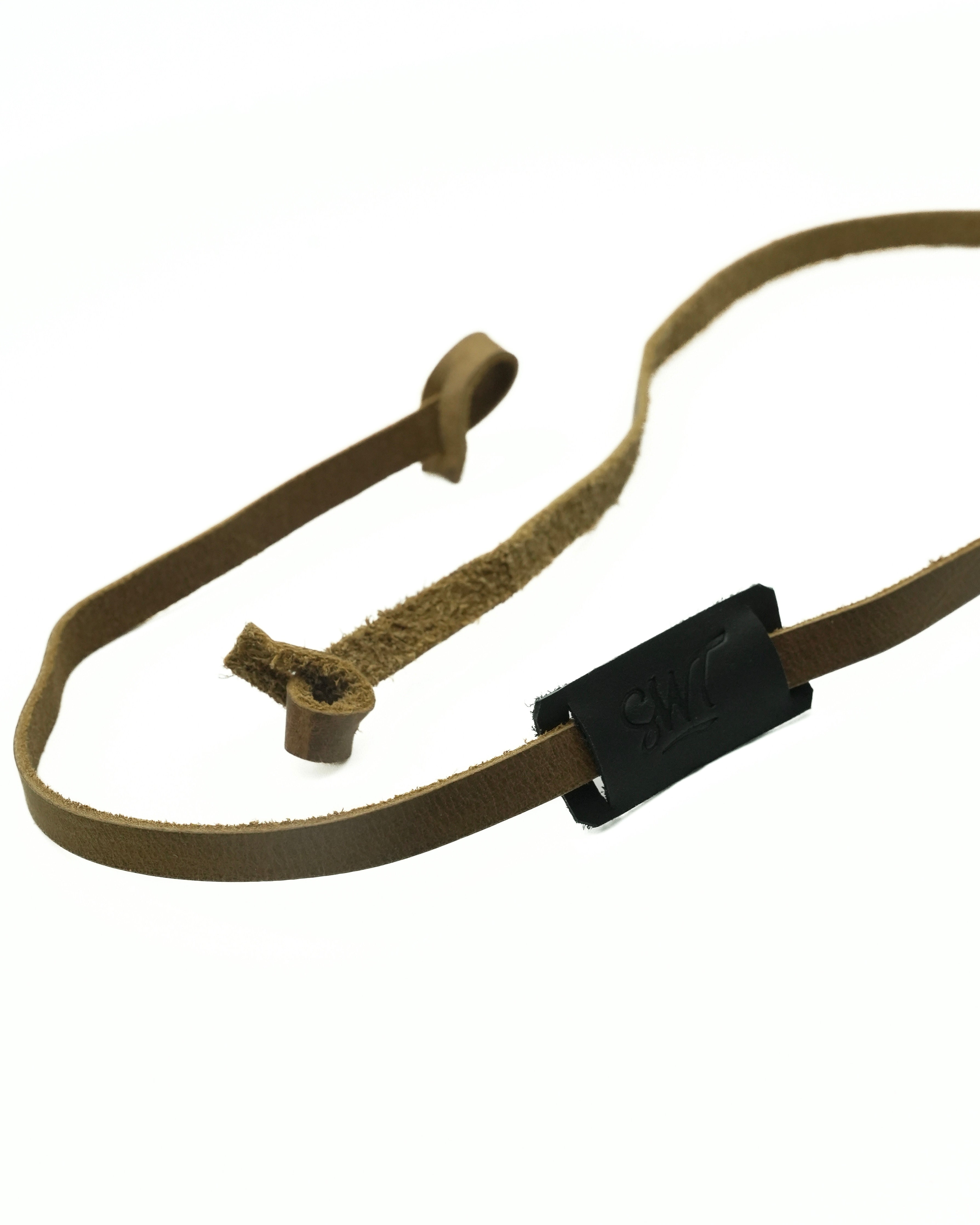 SWT brown and black leather sunglasses strap, sliding label detail