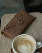 SWT brown leather sunglasses case, full-grain buffalo leather texture