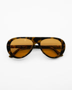 Dragon sunglasses by SWT, dark tortoiseshell aviator frame with warm amber lenses, front view