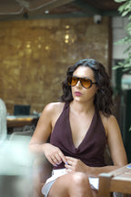 Dragon sunglasses by SWT, dark tortoiseshell aviator with amber lenses, worn view
