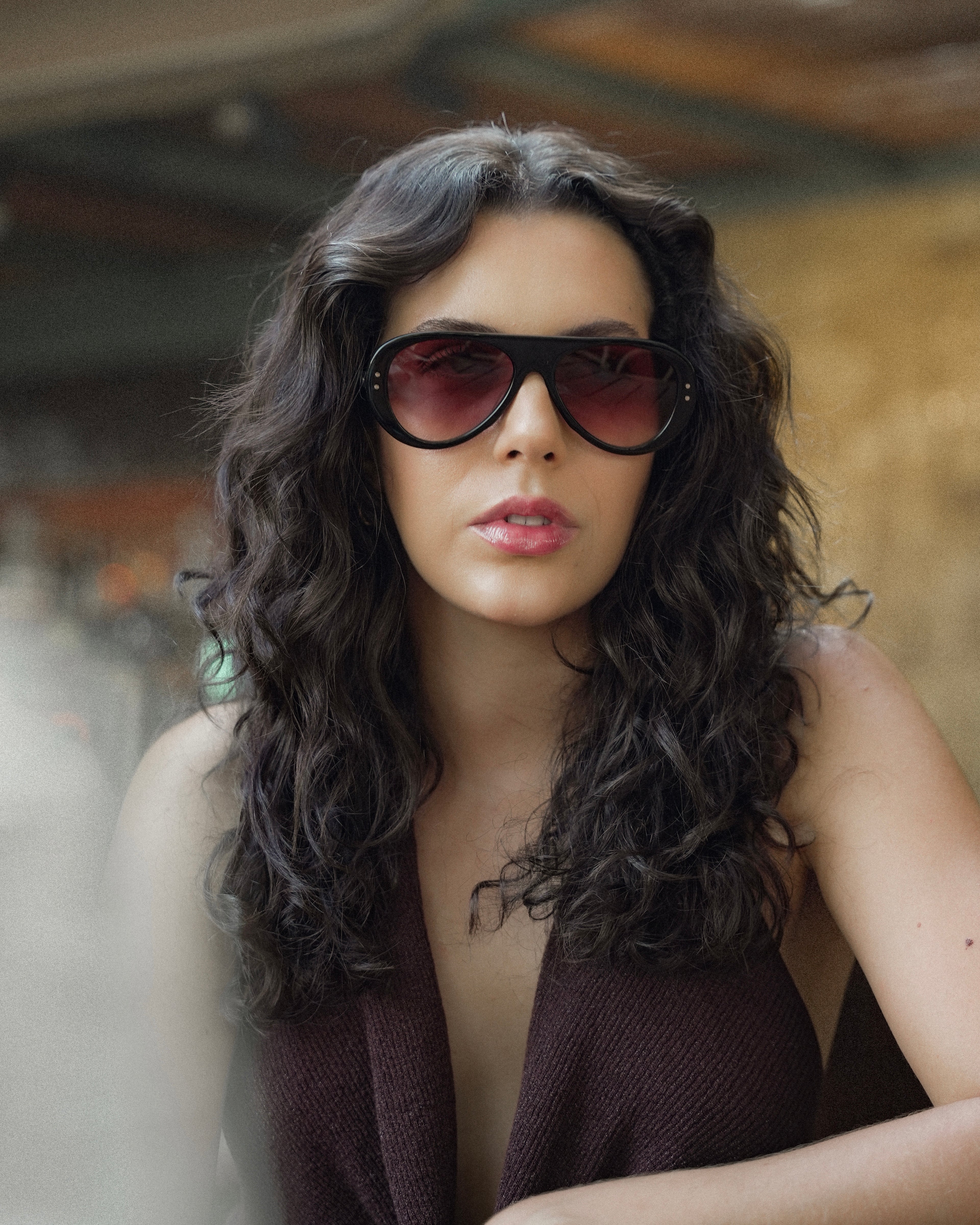 Reserve sunglasses by SWT, close-up of burgundy gradient lens and rivet detail