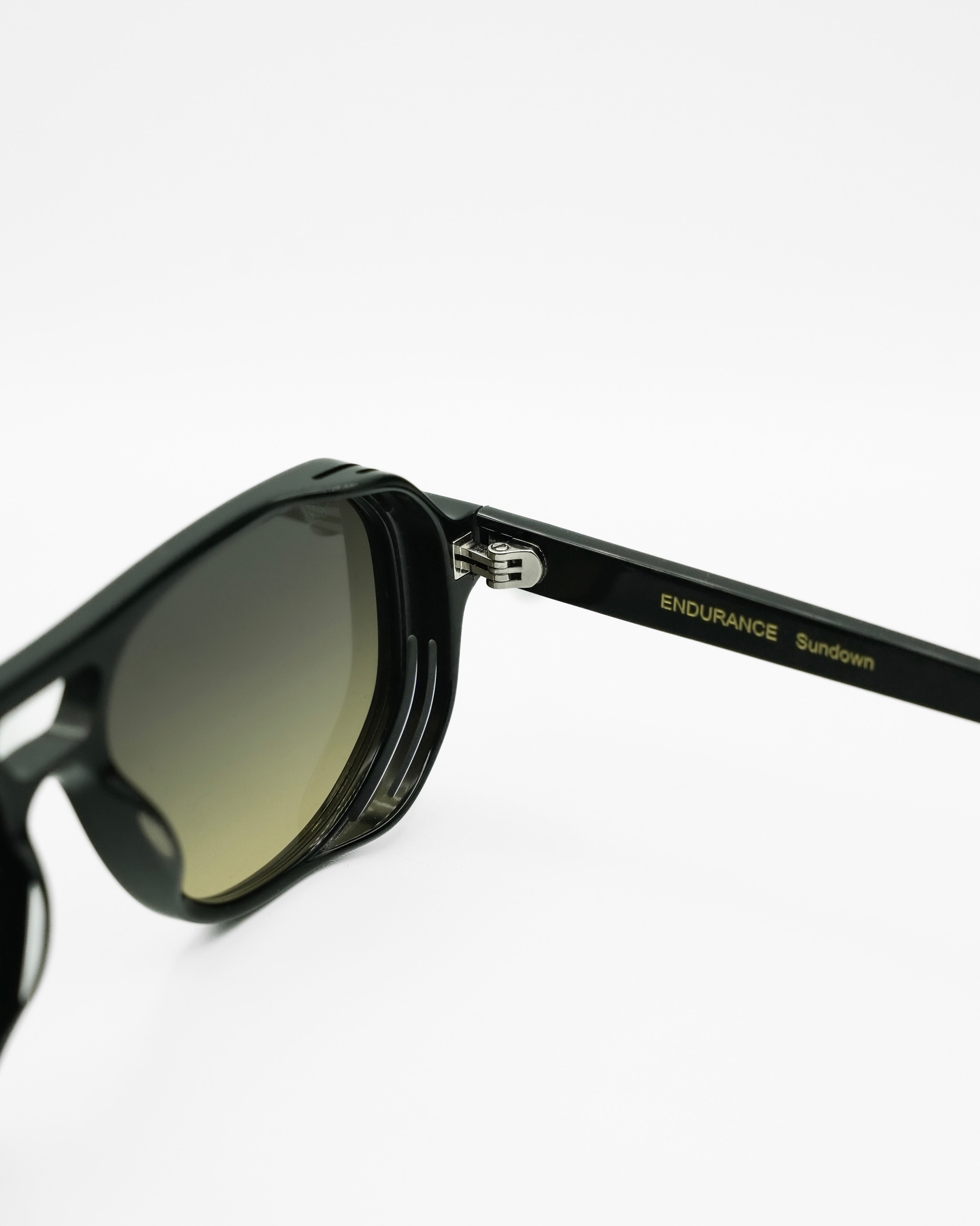 Sundown sunglasses by SWT, black aviator with green to yellow gradient lenses, side view
