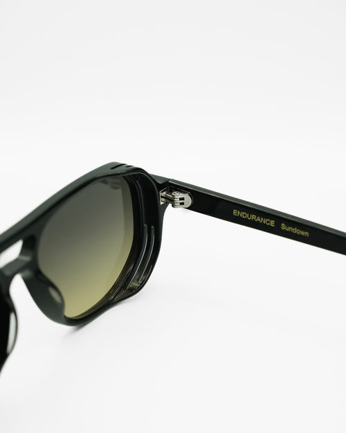 Sundown sunglasses by SWT, black aviator with green to yellow gradient lenses, side view