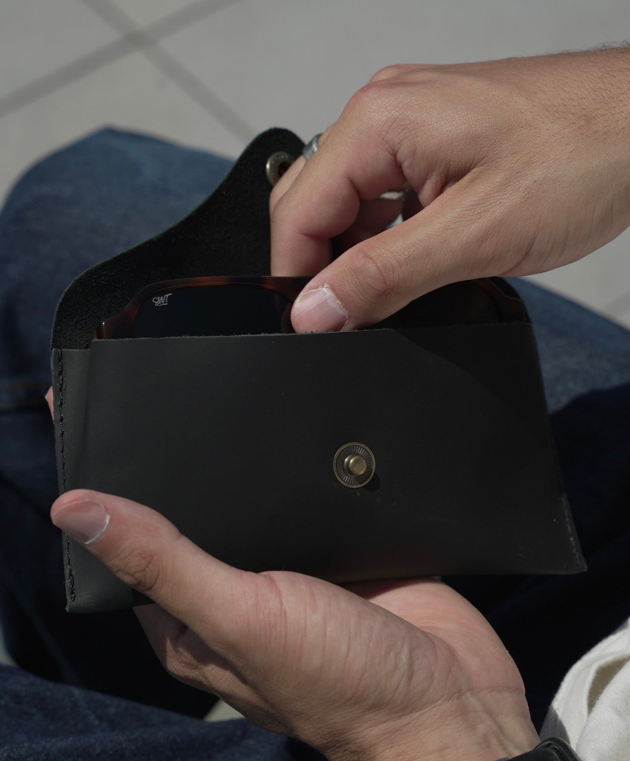 SWT black leather sunglasses case, matte finish, side view