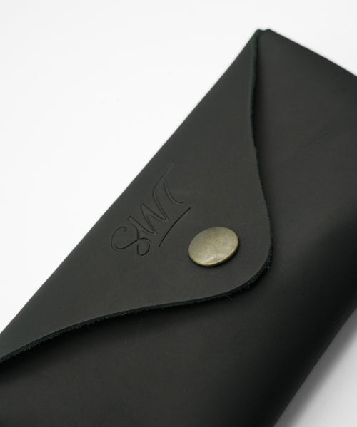 SWT black leather sunglasses case, open with sunglasses inside