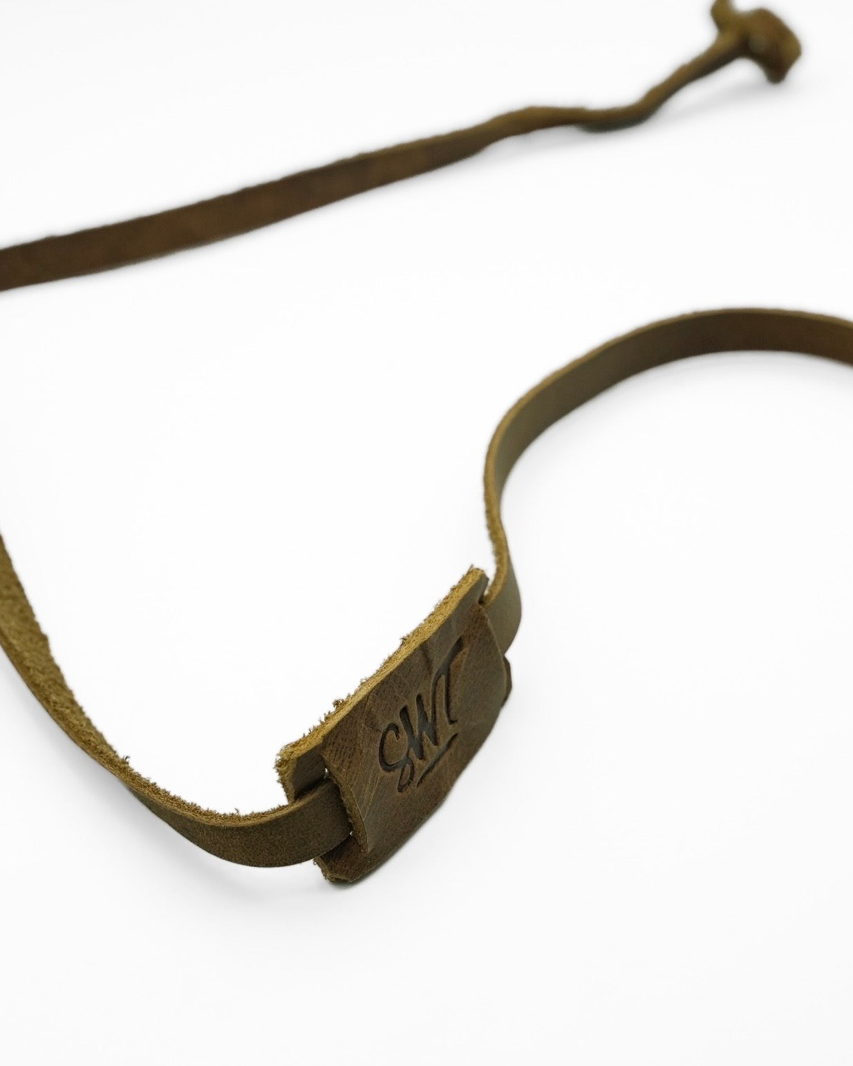 SWT brown leather sunglasses strap attached to sunglasses