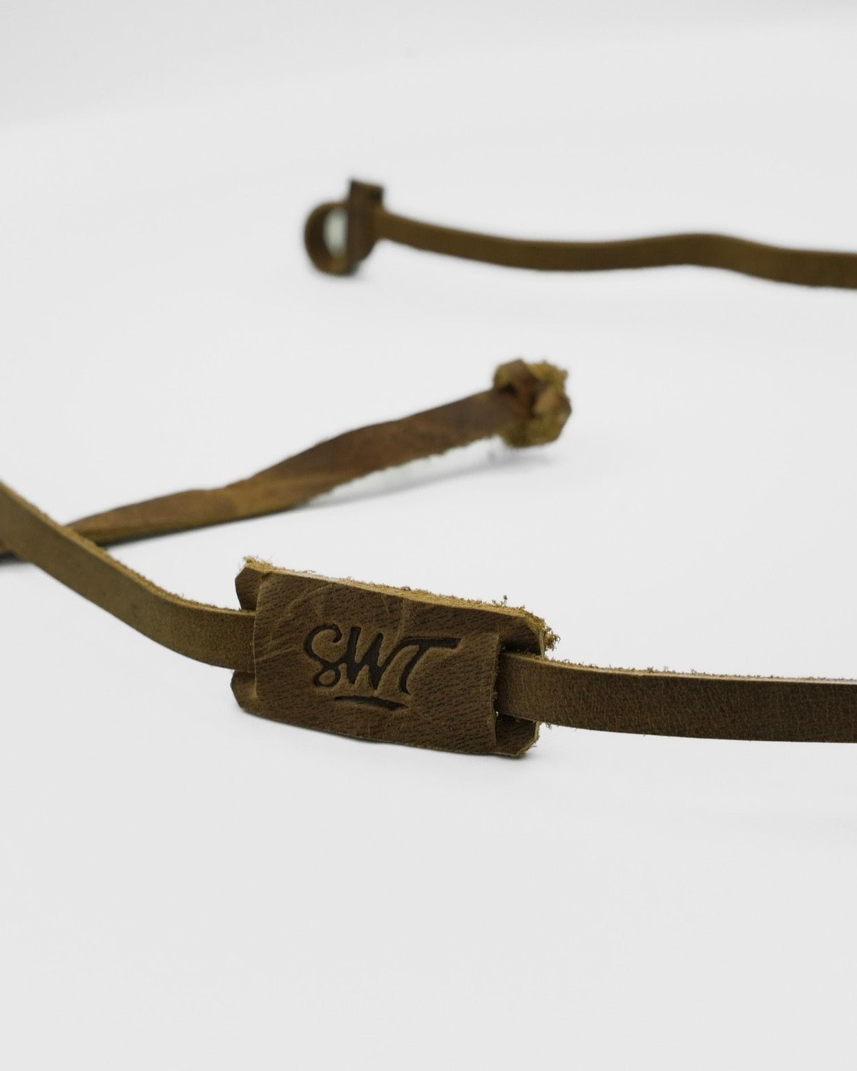SWT brown leather sunglasses strap, sliding label detail