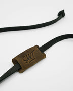 SWT black and tan leather sunglasses strap attached to sunglasses