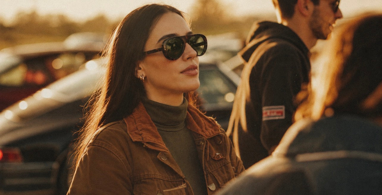 Woman wearing SWT tortoiseshell aviator sunglasses in a classic car event in afternoon light